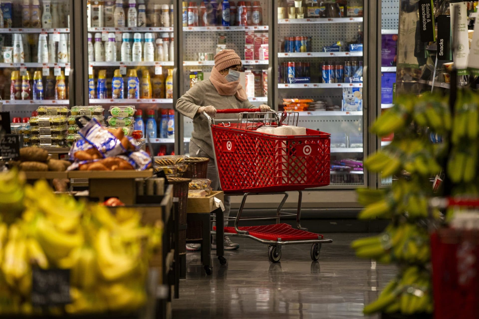 March 18: A woman wearing a face mask shops at Target in Watertown. (Jesse Costa/WBUR)