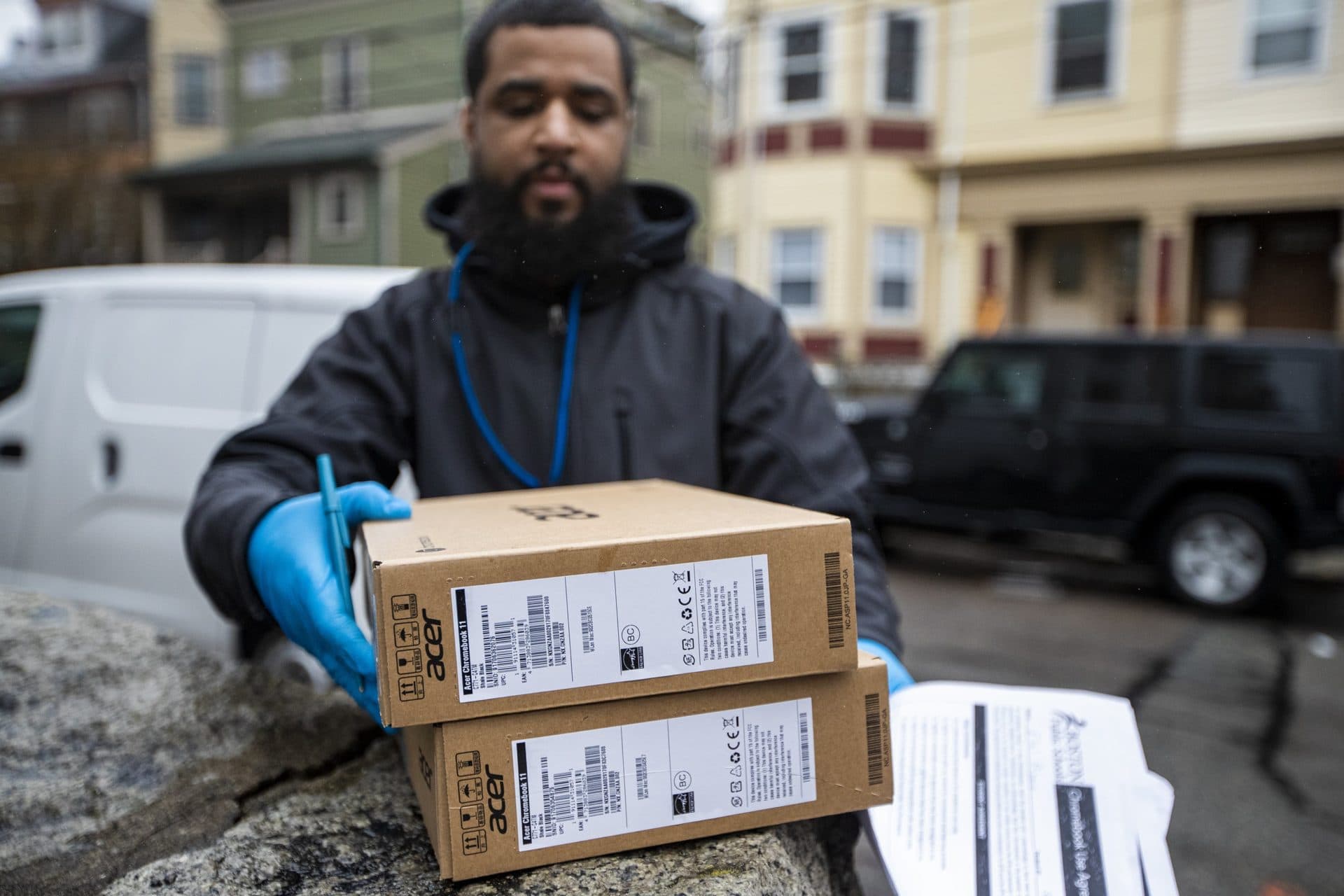 March 19: Giscar Centeio prepares to deliver two Chromebooks to Boston Public Schools students living in Roxbury, after Mayor Marty Walsh announced the city would move to remote learning. (Jesse Costa/WBUR)
