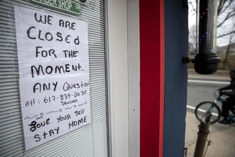 A sign on the door of the Nice Haircut Barber Shop on Dorchester Ave. in Boston. (Robin Lubbock/WBUR)