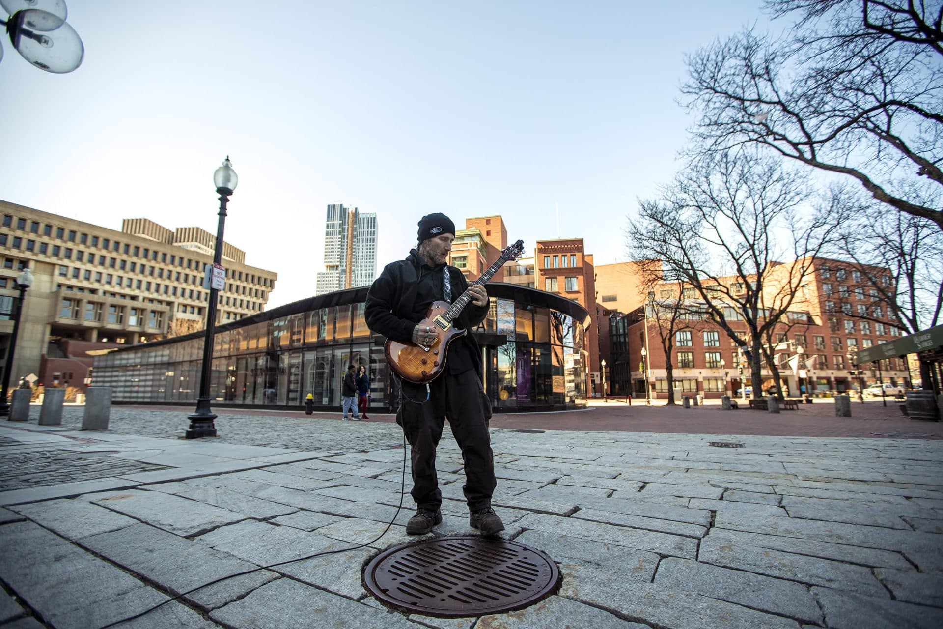 March 27: Street guitarist Matty X plays to an empty Faneuil Hall. (Jesse Costa/WBUR)