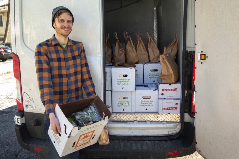 Andrew Lacasse makes deliveries for What Cheer Fruit & Produce, a company that works with small, organic New England growers. (Andrea Shea/WBUR)