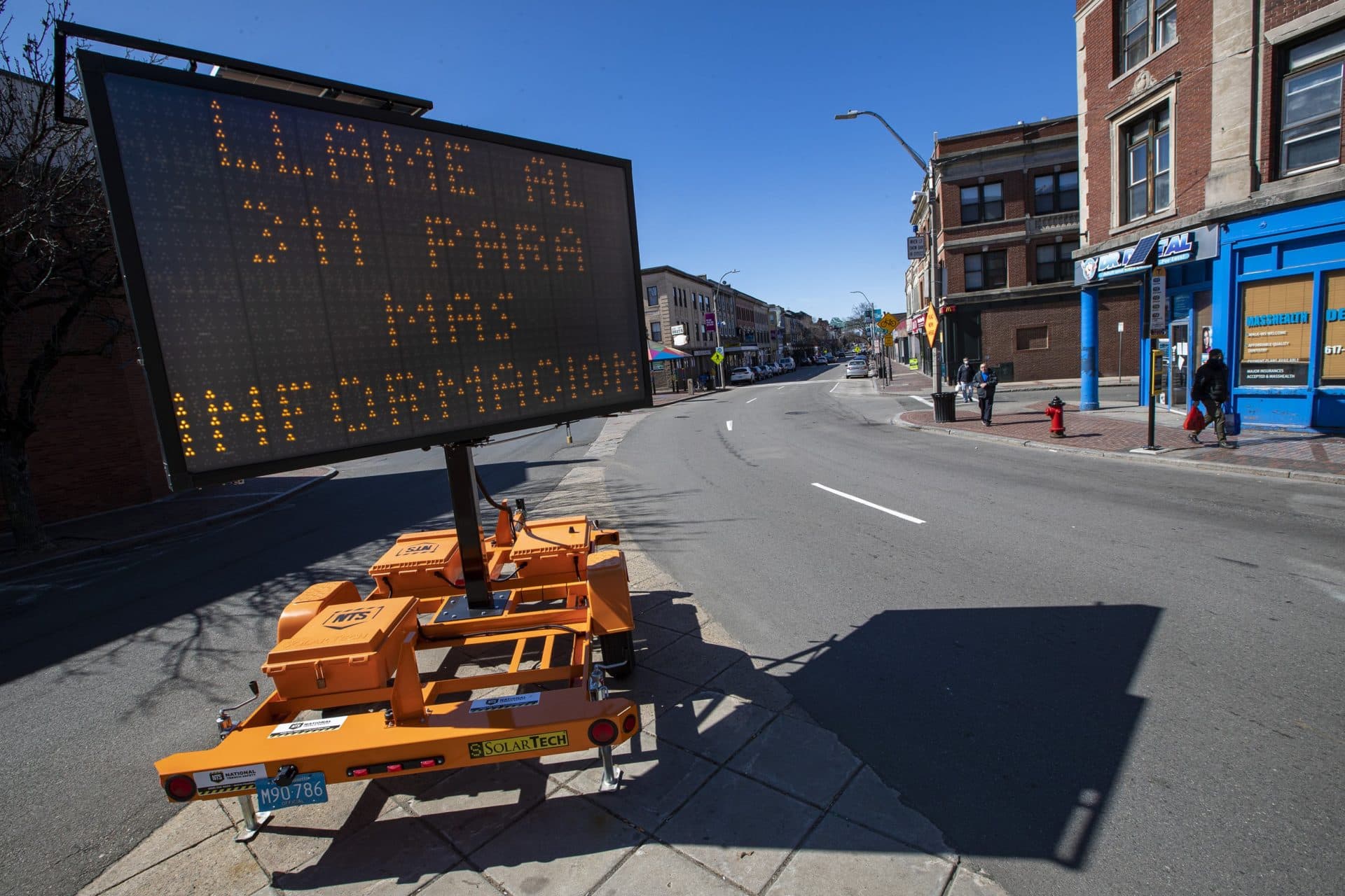 April 7: A sign in Chelsea Square informing residents of a student-feed program happening in the city. (Jesse Costa/WBUR)