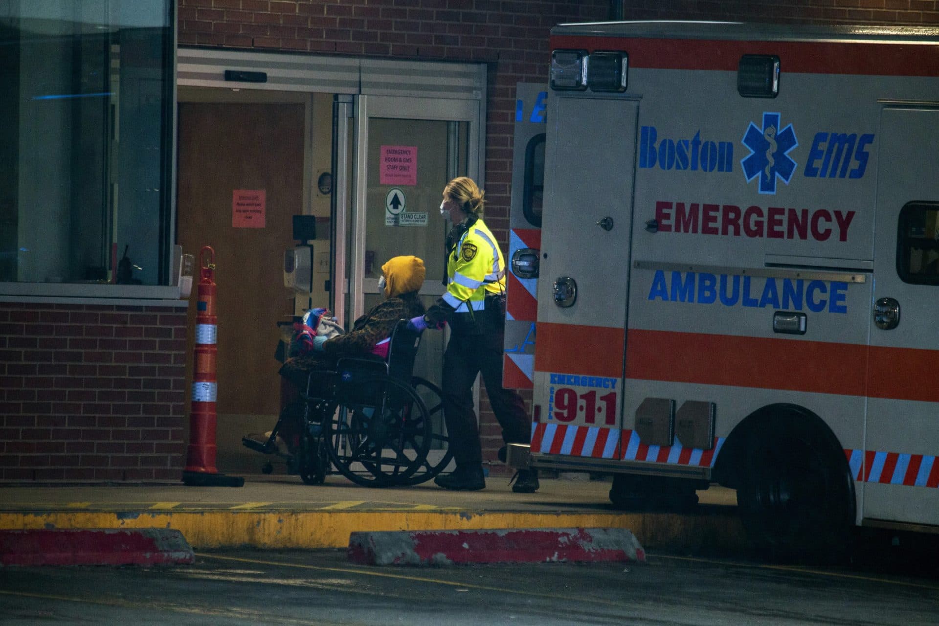 April 9: Boston EMS wheels a patient into the emergency entrance at Boston Medical Center. (Jesse Costa/WBUR)