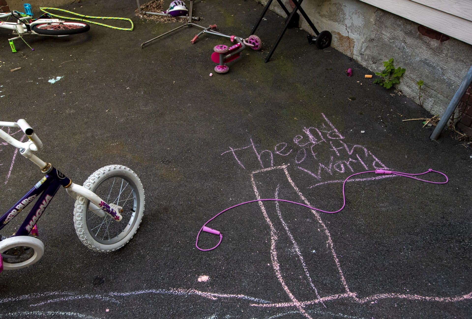 April 12: A children’s chalk drawing in the backyard of a Somerville apartment house. (Jesse Costa/WBUR)