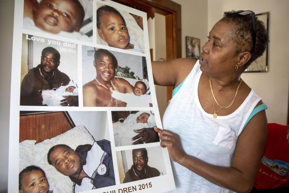 Janice Pendleton with images of her brother, Rodrick Pendleton, and his children. He died in the Suffolk County House of Correction. (Robin Lubbock/WBUR)