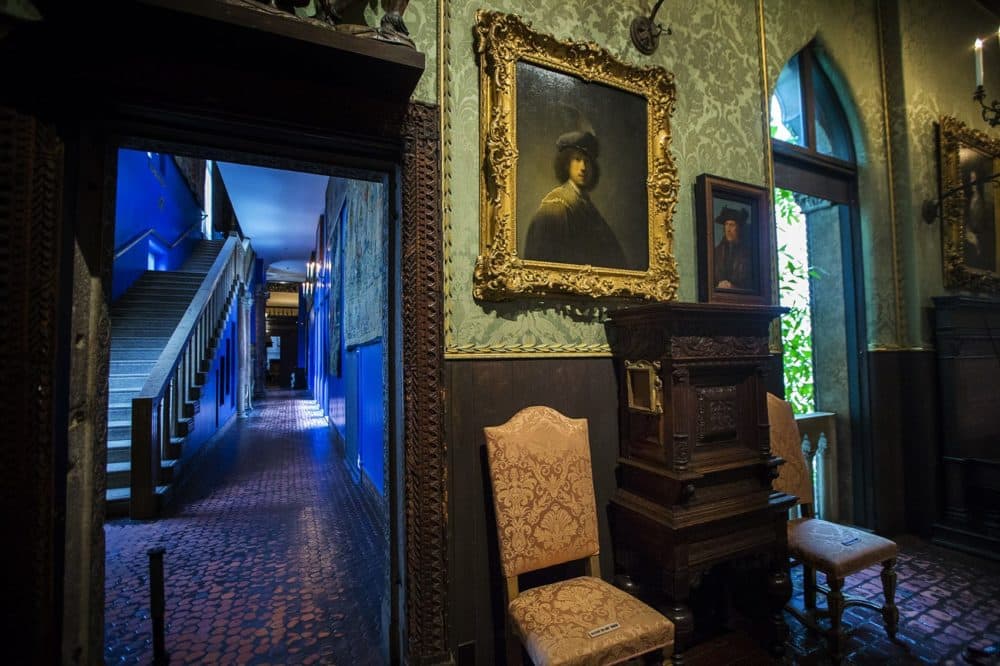 &quot;Self Portrait&quot; by Rembrant on the wall of the Dutch Room as well as the empty frame of his &quot;Self Portrait&quot; etching mounted to the side of cabinet below. (Jesse Costa/WBUR)