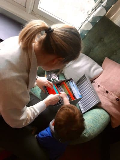 Tremaine looking through her box of treasures with her son, Parker. (Tressa Versteeg)