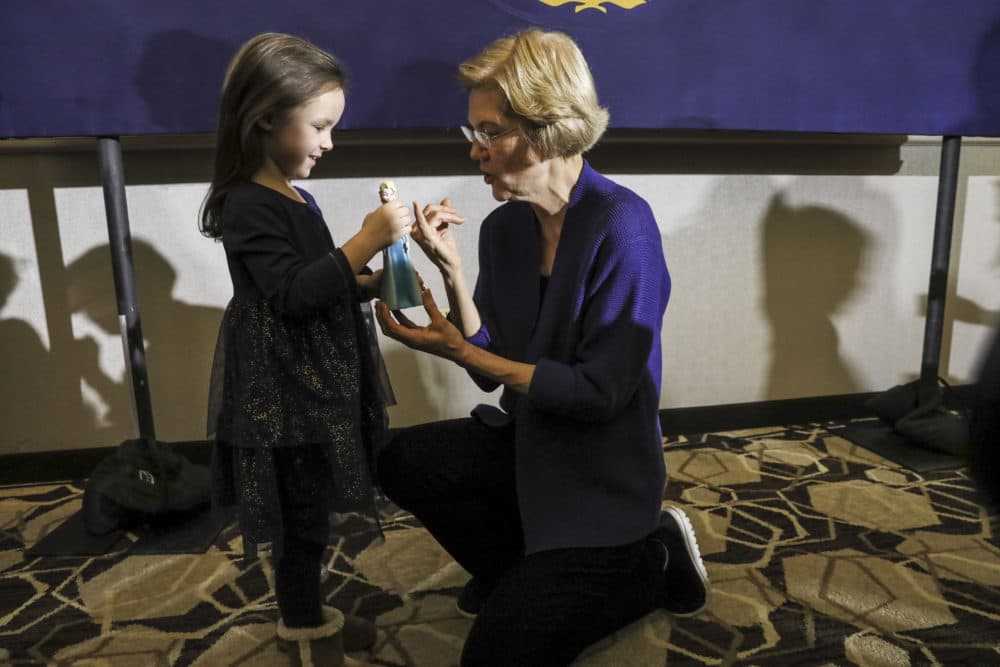 Democratic presidential candidate Sen. Elizabeth Warren, D-Mass., talks with a young girl during a meet and greet after speaking at a campaign event Thursday, Jan. 2, 2020, in Concord, N.H. (Cheryl Senter/AP)