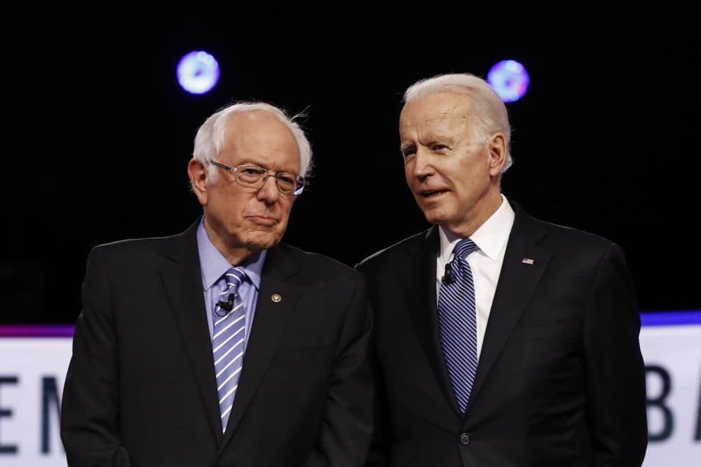 Democratic presidential candidates, Sen. Bernie Sanders, I-Vt., former Vice President Joe Biden, talk before a Democratic presidential primary debate, Tuesday, Feb. 25, 2020, in Charleston, S.C. (Matt Rourke/AP)