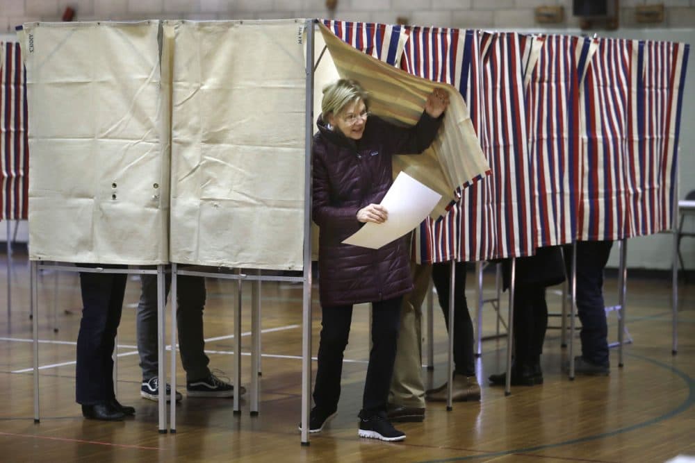 Democratic presidential candidate Sen. Elizabeth Warren, D-Mass., emerges from the booth with her ballot as she votes on Tuesday in Cambridge. (Steven Senne/AP)