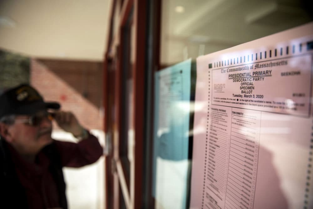 Army veteran Bob Perry enters a polling precinct to cast a ballot in the Massachusetts presidential primaries in Seekonk. (David Goldman/AP)