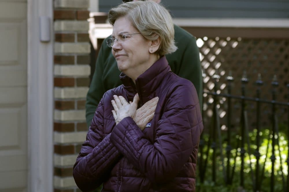 Sen. Elizabeth Warren acknowledges supporters outside her home in Cambridge, Thursday, March 5, 2020, before speaking to the media about her decision to suspend her presidential campaign. (AP Photo/Steven Senne/AP)