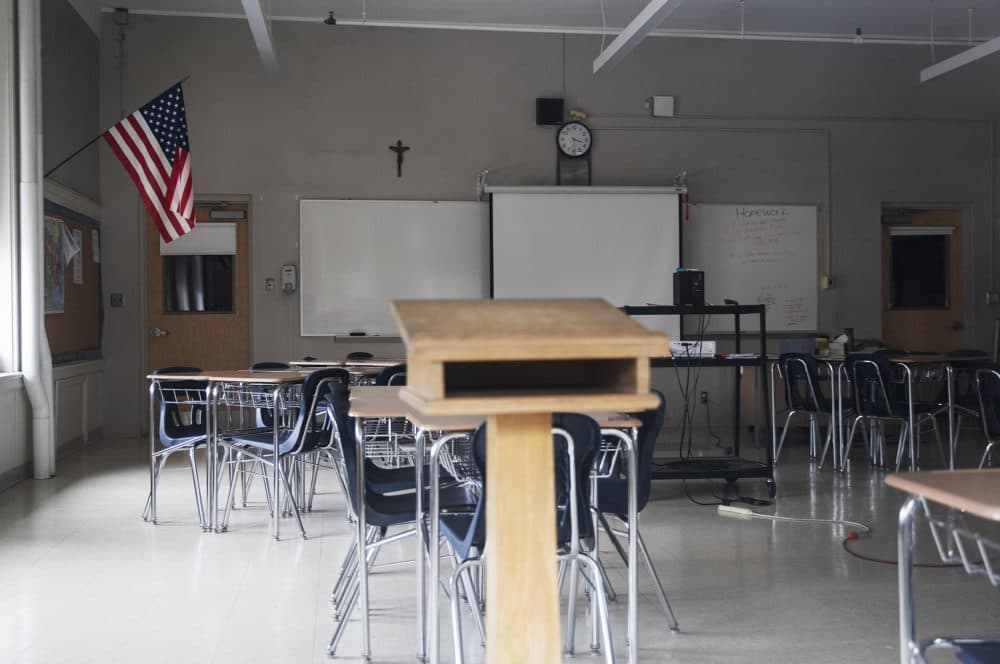 A classroom is seen vacant through a window at Saint Raphael Academy in Pawtucket, R.I., as the school remains closed following a confirmed case of the coronavirus. (David Goldman/AP)
