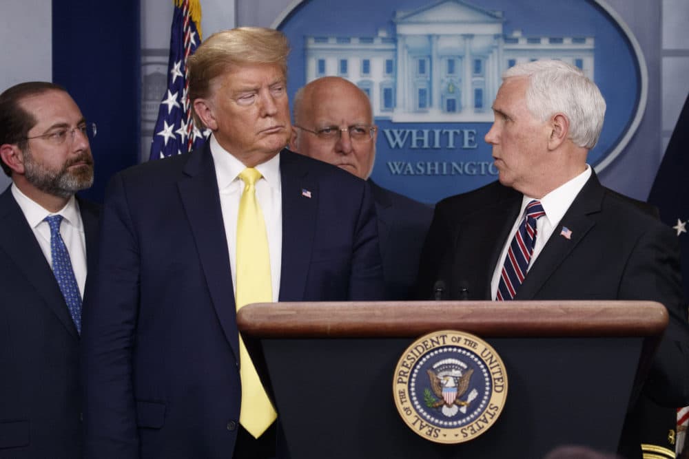 Vice President Mike Pence turns to President Donald Trump as he speaks in the briefing room of the White House in Washington, Monday, March, 9, 2020, about the coronavirus outbreak as Health and Human Services Secretary Alex Azar, Dr. Robert Redfield, and director of the Centers for Disease Control and Prevention, listen. (Carolyn Kaster/AP)