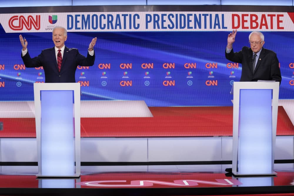 Biden, left, and Sanders, I-Vt., right. (Evan Vucci/AP)