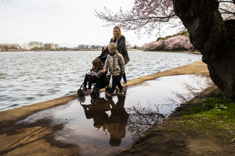 Michaella Pratt and her children Preston, 6, Aubrey, 4, from Arlington, Va., use their time with school closing because of the coronavirus outbreak, to visit the near-empty Tidal Basin in Washington, Monday, March 16, 2020. (Manuel Balce Ceneta/AP)