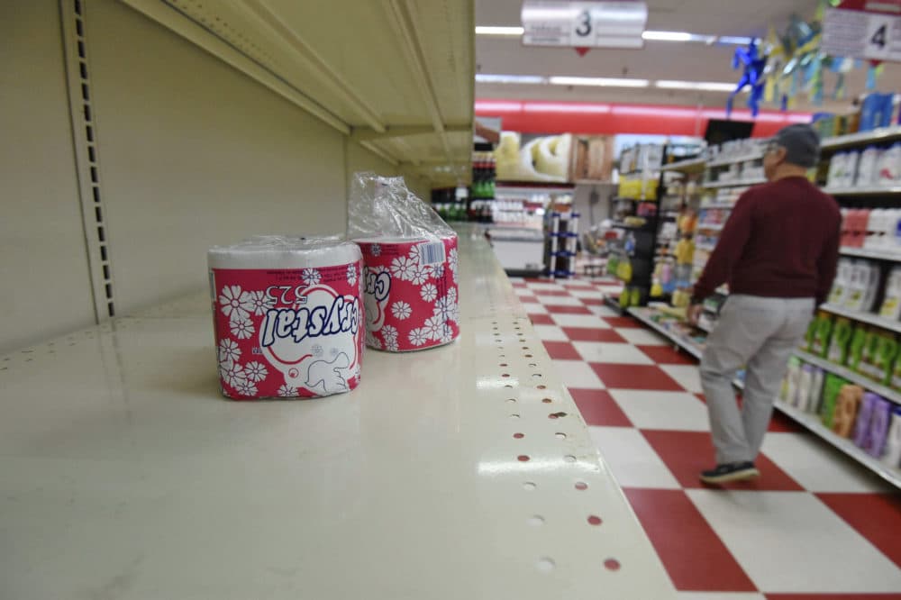 A customer walks down the toilet paper aisle at La Unica Supermarket Wednesday, March 18, 2020, in Greenville, S.C. (Richard Shiro/AP)