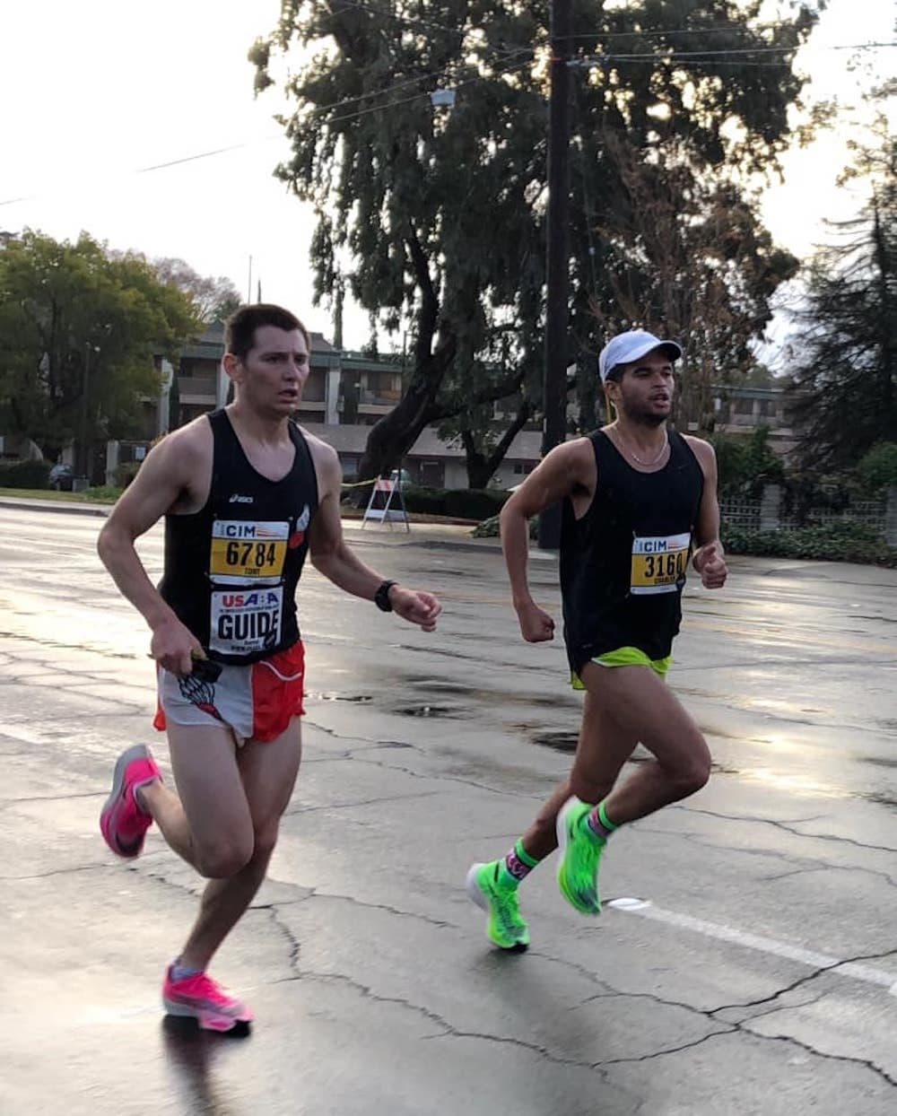 Chaz Davis, right, runs with a guide. (Courtesy of Adaptive Sports New England)