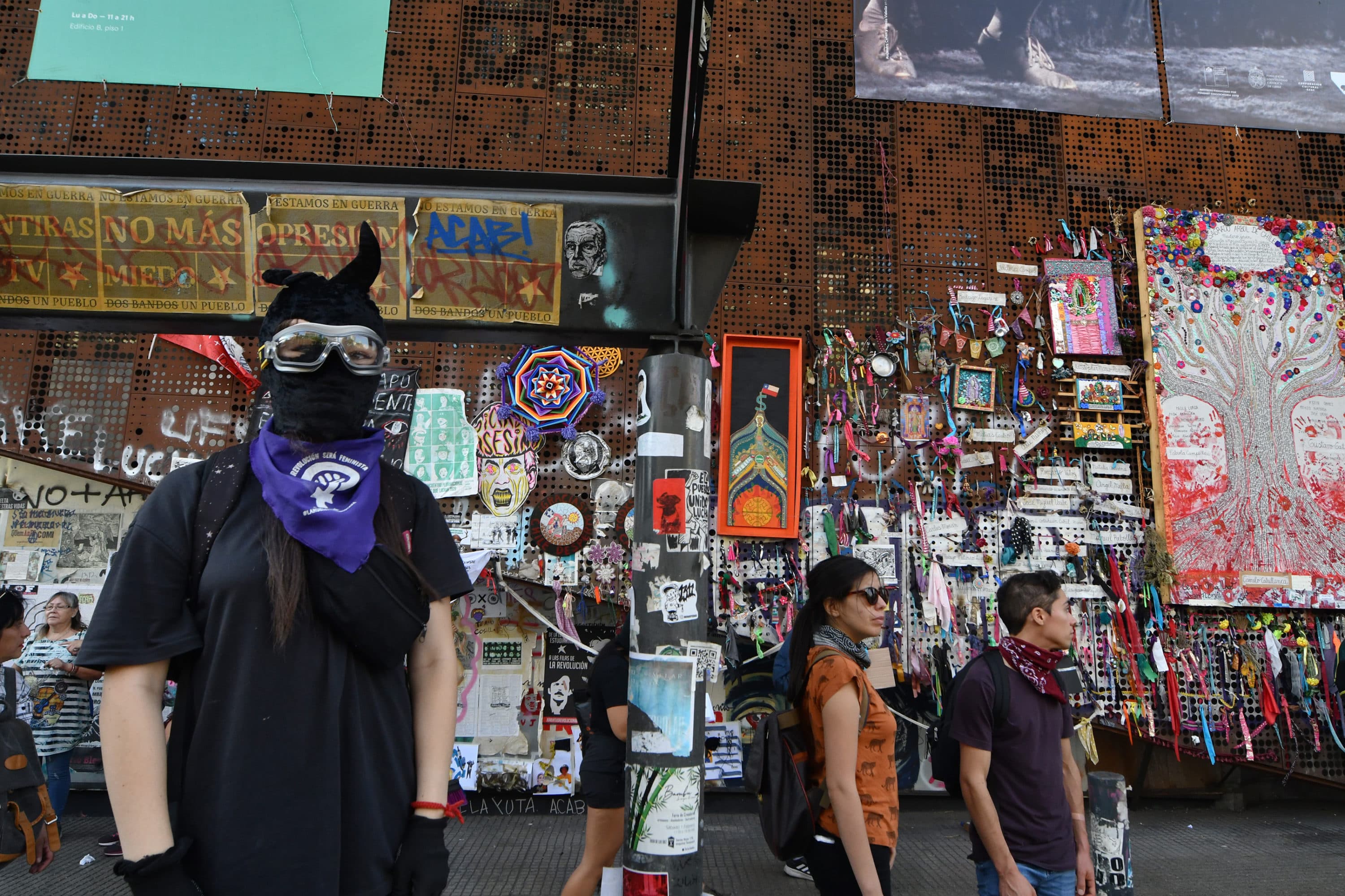 Protestors and theater festival attendees meet outside the Gabriela Mistral Cultural Center in Santiago. (Jorge Sanchez for WBUR)