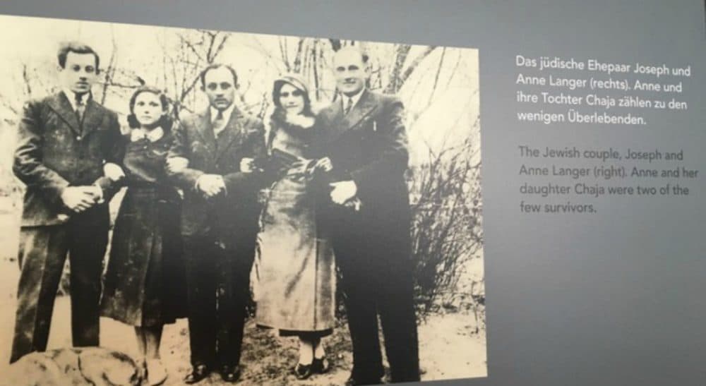 This is a photo from the "Mass Shootings” exhibit in Berlin. My mother's father, Yosef, is on the far right, was killed after someone in the town betrayed him. Next to him is my mother’s mother, Ann, who survived the war in hiding with my mother. My mother's childhood dog is pictured on the bottom left of the photo. (Courtesy)