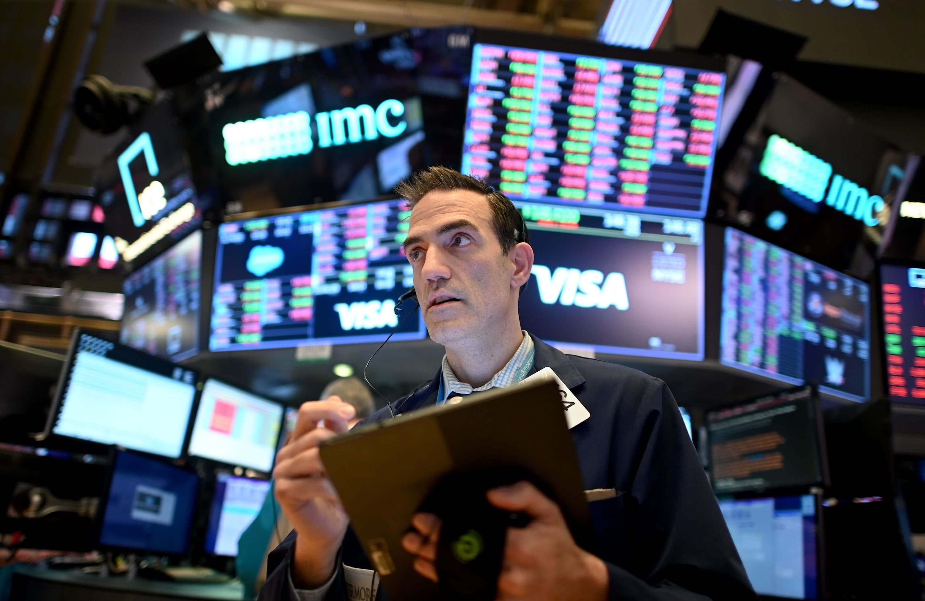 Traders work during the closing bell at the New York Stock Exchange (NYSE) on March 18, 2020 at Wall Street in New York City. (JOHANNES EISELE/AFP via Getty Images)
