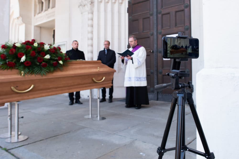 Deacon Otmar Gindl and employees of Bestattung Himmelblau undertakers rehearse the livestreaming of an upcoming funeral on March 24, 2020 in Vienna, Austria. (Thomas Kronsteiner/Getty Images)