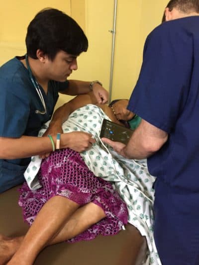 Dr. Victor Flores treats a patient in a clinic in Opatoro, Honduras.