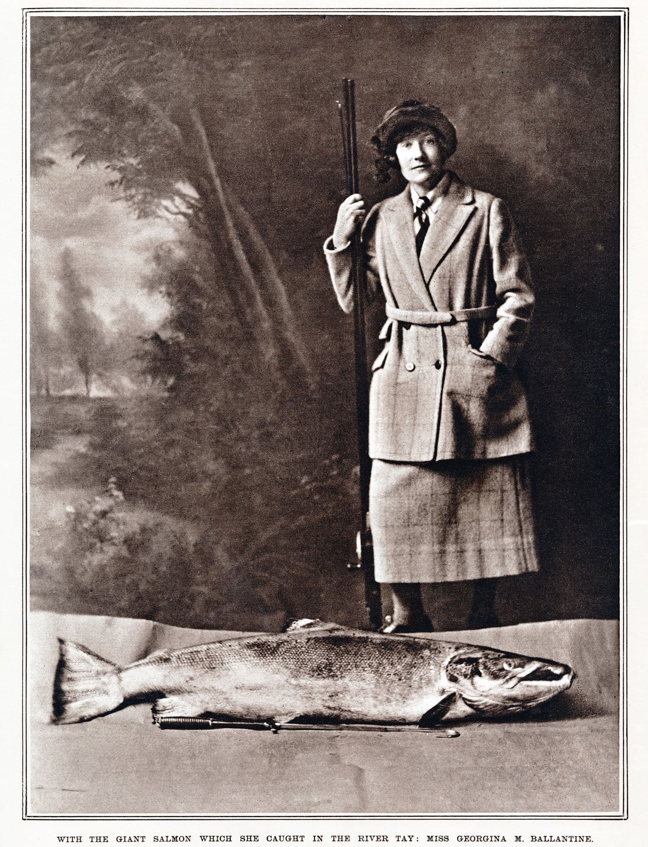 Georgina Ballantine in 1922 with her sixty-four pound Atlantic salmon caught on the River Tay. It is the largest salmon ever caught on a rod in the British Isles. (Lordprice Collection/Alamy Stock Photo)