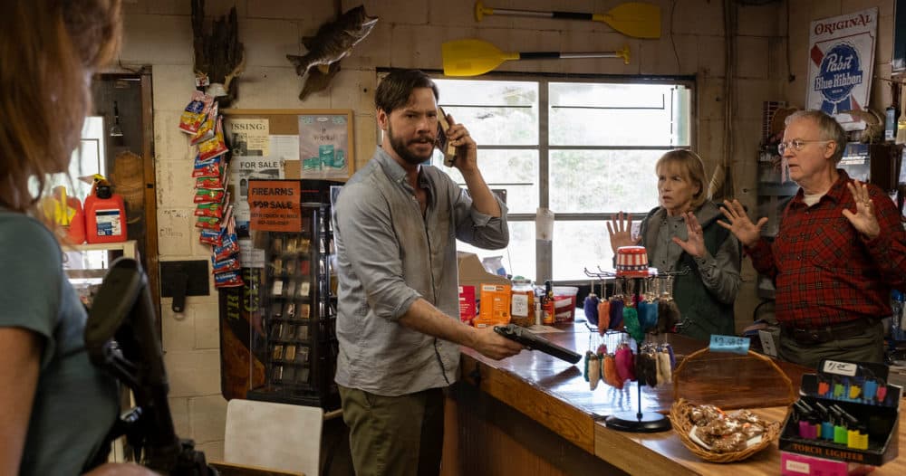 Ike Barinholtz, center, in &quot;The Hunt.&quot; (Courtesy Universal Pictures)