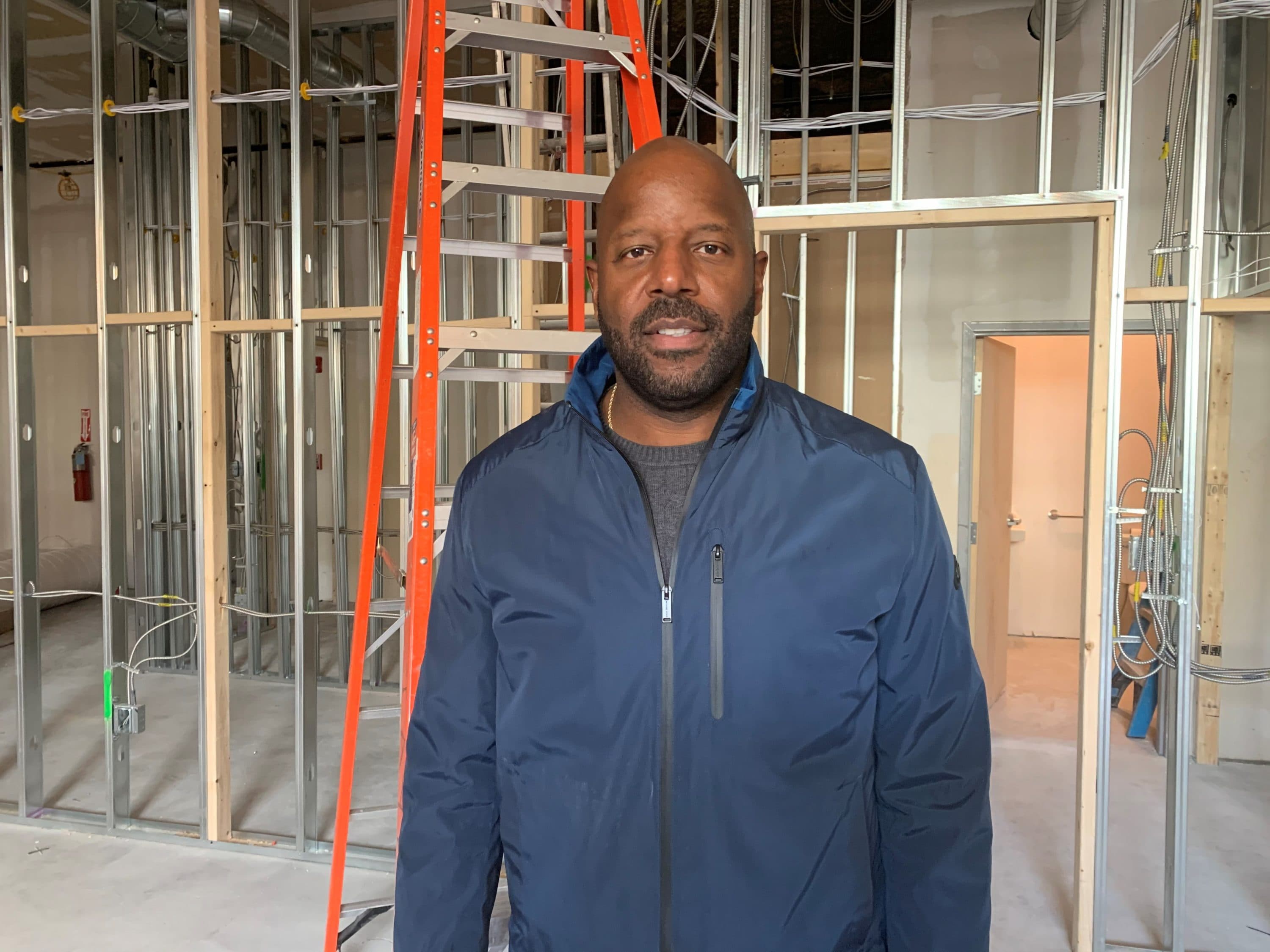Kobie Evans is one of the owners of Pure Oasis in Grove Hall. (Paris Alston/WBUR)