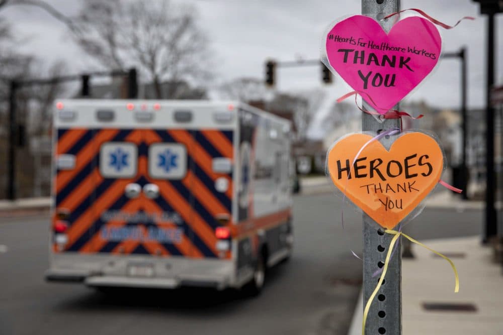 A message left on a street signpost by the Melrose Wakefield Hospital with #HeartsForHealthcareWorkers, says &quot;Thank you.&quot; (Robin Lubbock/WBUR)
