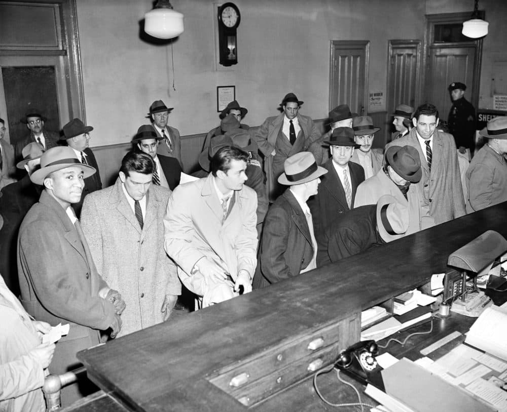 Just a year after winning the 1950 NIT and the NCAA Tournament, City College players were arrested for their involvement in the point shaving scandal. (AP)