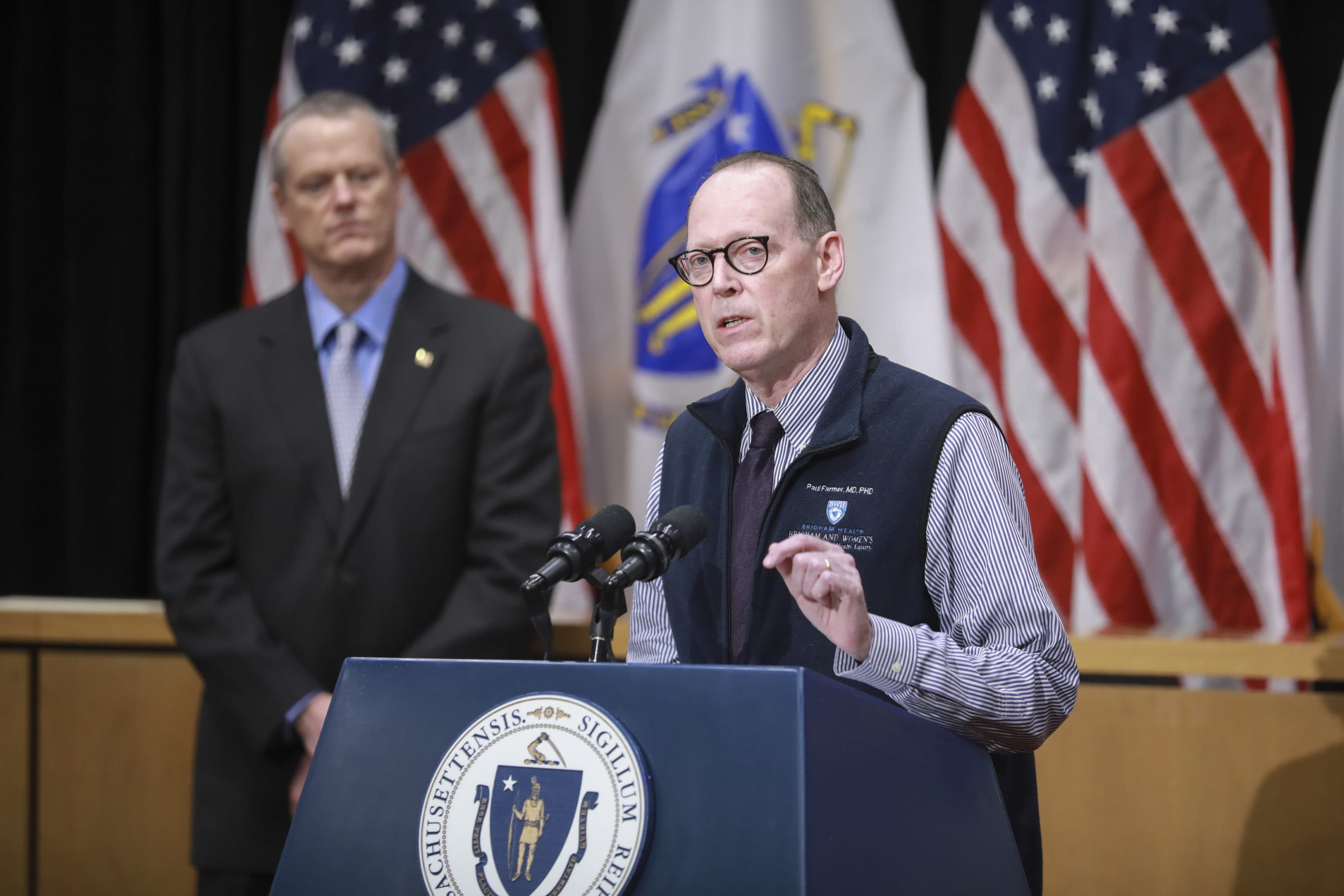 Chief strategist and co-founder of Partners In Health, Dr. Paul Farmer, joins Massachusetts Gov. Charlie Baker to give an update to cases of coronavirus in the state. (Nicolaus Czarnecki/MediaNews Group/Boston Herald)