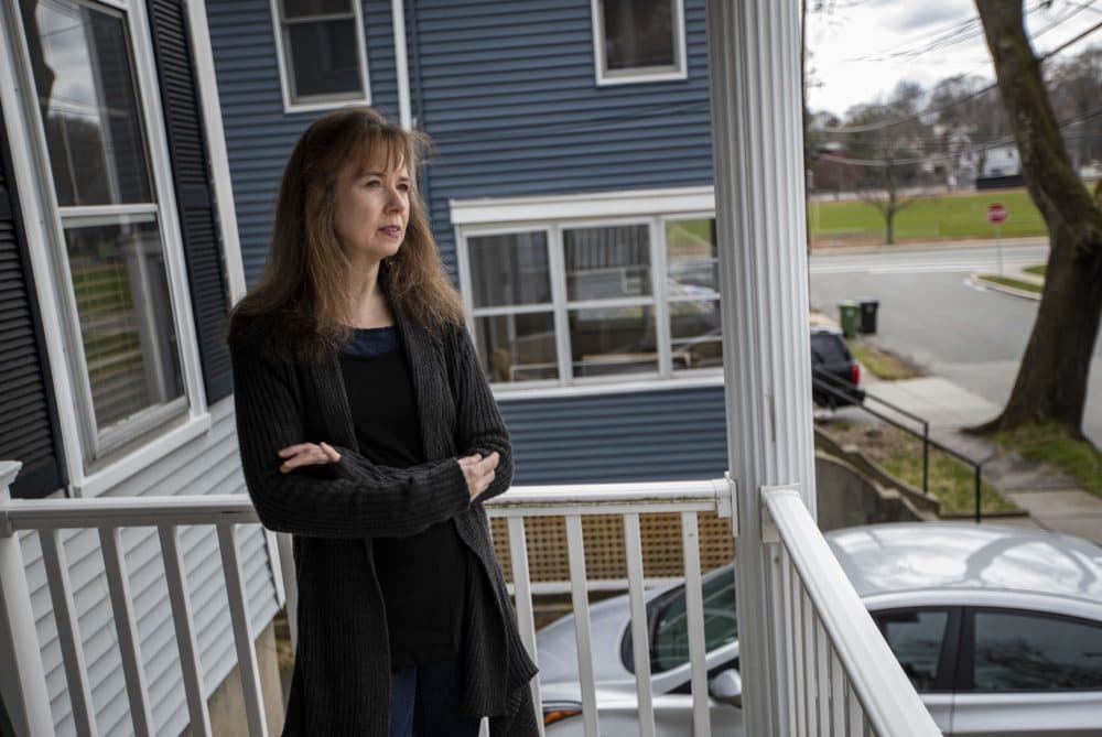 Phyllis Rittner, standing on her porch in Watertown says the coronavirus pandemic has made her PTSD and anxiety reemerge. (Jesse Costa/WBUR)