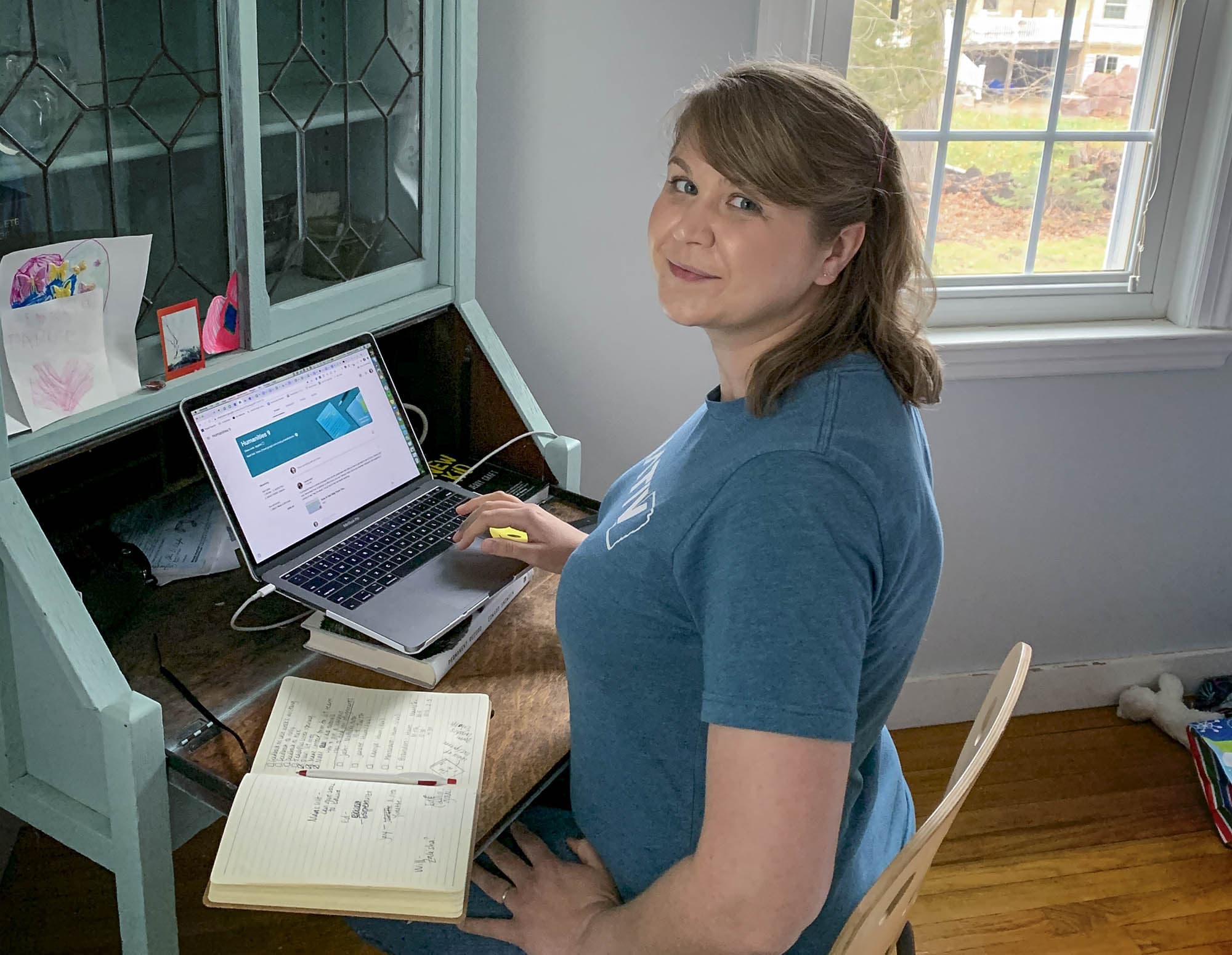 Sydney Chaffee, a humanities teacher at the Codman Academy, works on a laptop. (Courtesy, Sydney Chaffee)