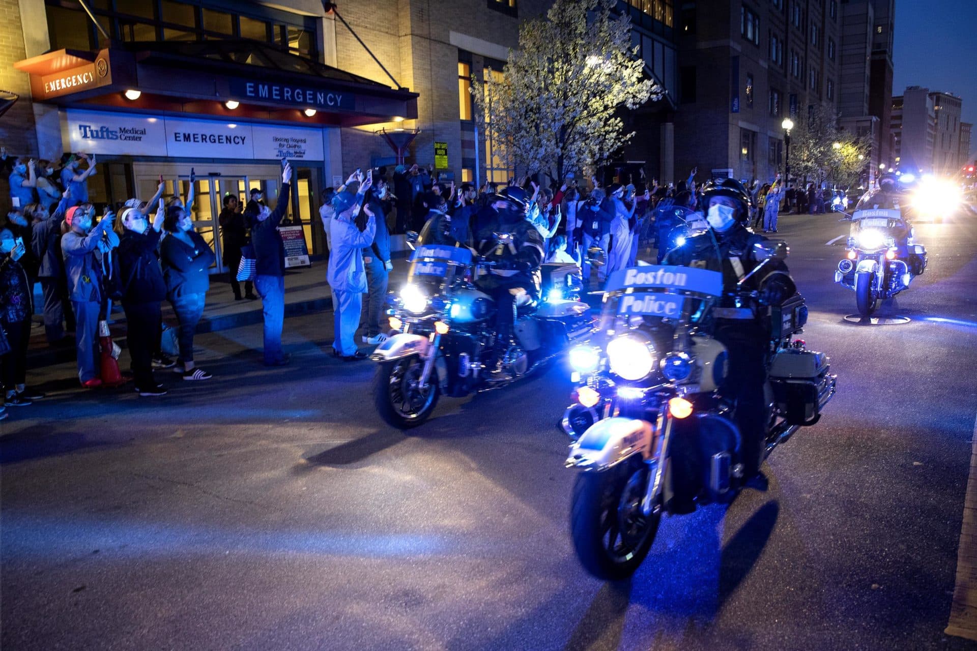 Police motorcyclists led a cavalcade of emergency vehicles on a tour of Boston hospitals to show support for healthcare workers. (Robin Lubbock/WBUR)