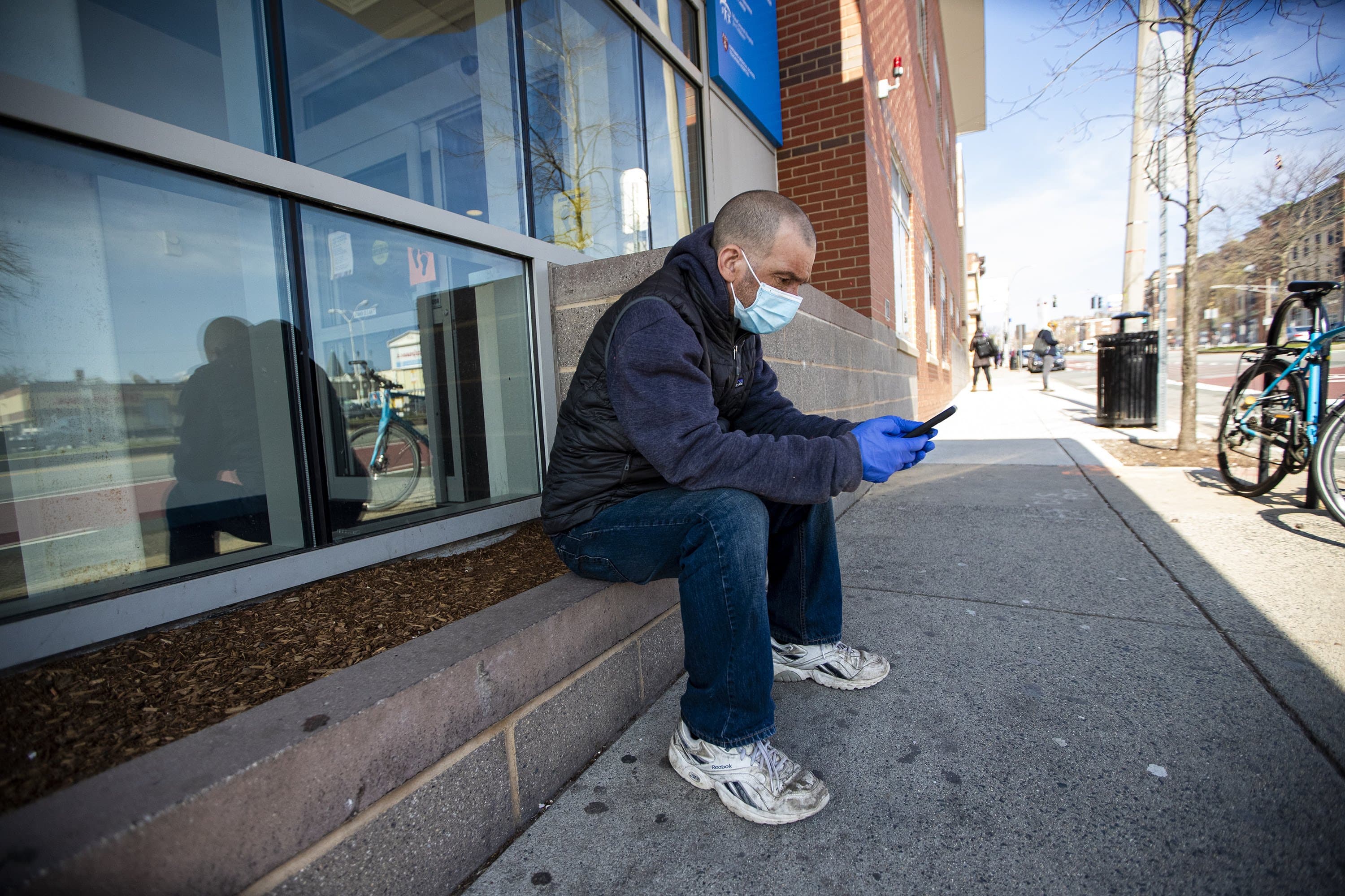 Bruce Greene waits for his appointment at the COVID-19 clinic at the Cambridge Health Alliance's clinic. He was tested because he believed he came into contact with someone with the virus. (Jesse Costa/WBUR)