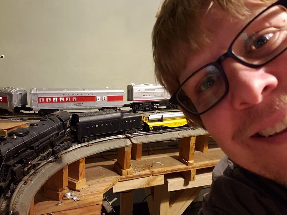 Matt, known as u/BigODetroit on Reddit, with his Lionel train set. (Courtesy u/BigODetroit)