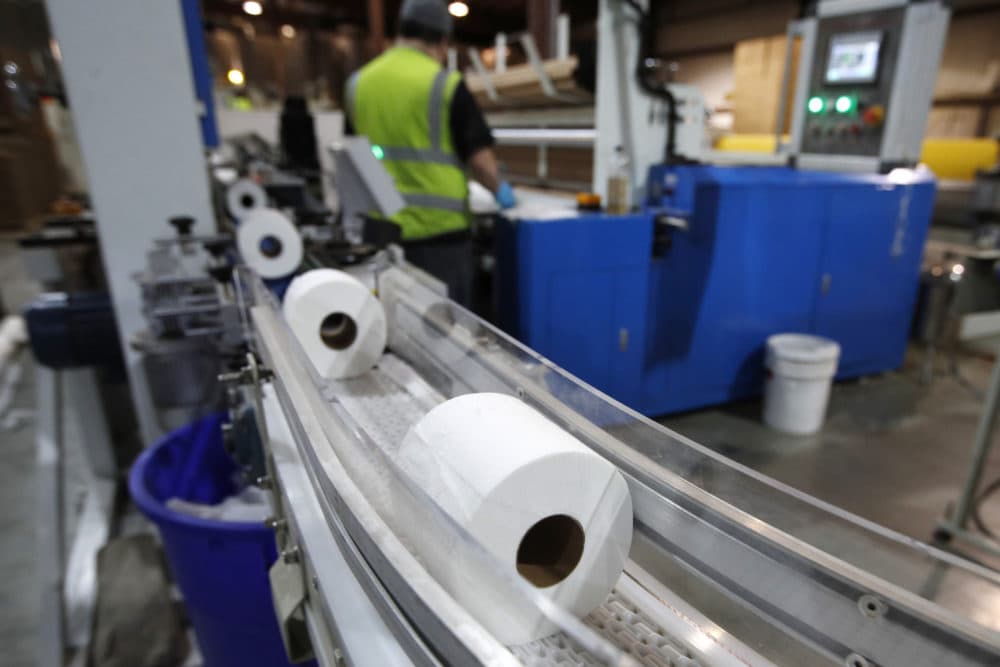 Toilet paper moves out from a cutting machine at the Tissue Plus factory in Bangor, Maine. (Robert F. Bukaty/AP)