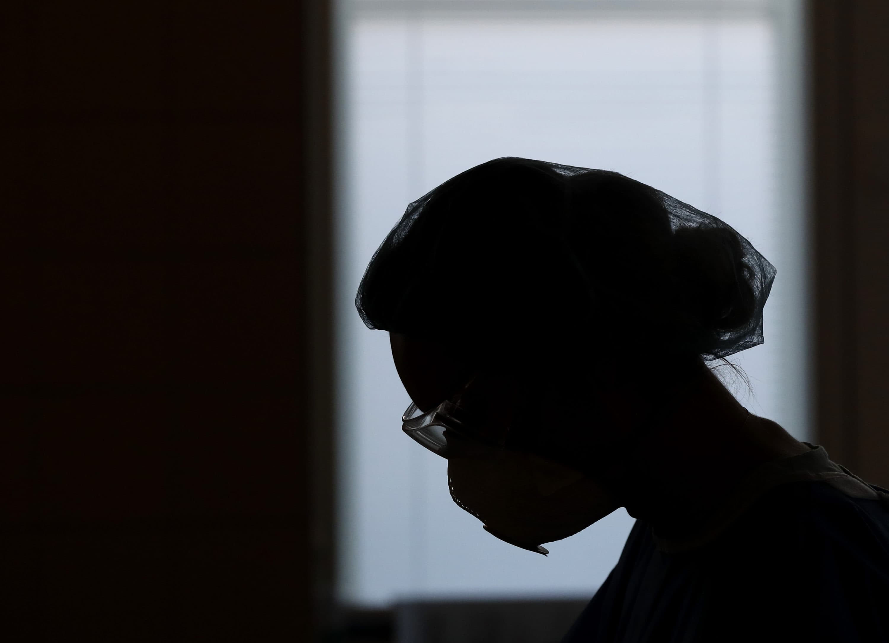 A healthcare worker during a shift at an intensive care unit at the General University Hospital where patients infected with the COVID-19 are treated in Prague, Czech Republic. (/Petr David Josek/AP)