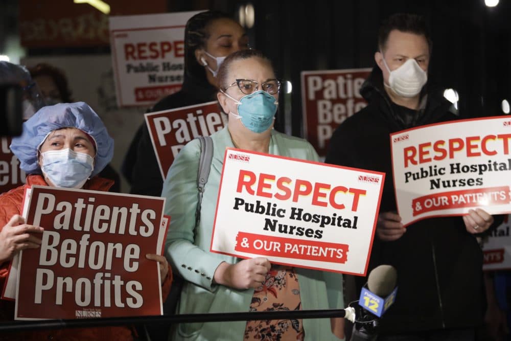 Nurses gather for a vigil in honor of healthcare workers fighting the coronavirus outbreak around the country, and calling for more personal protective equipment, outside Lincoln Hospital on Tuesday, April 14, 2020, in the Bronx borough of New York. (Frank Franklin II/AP Photo)