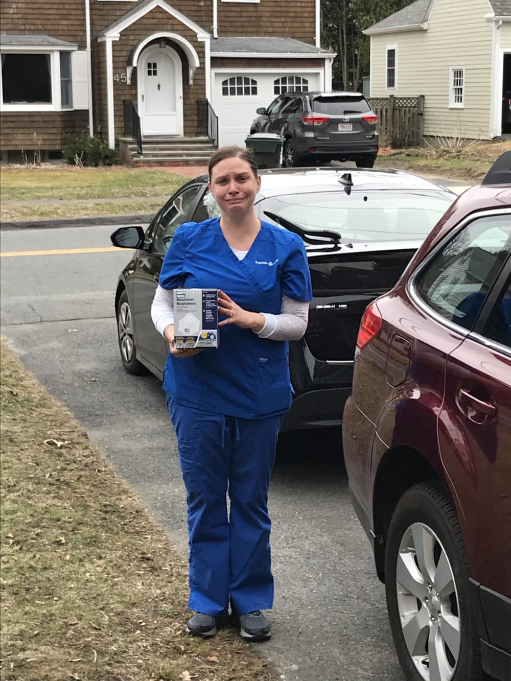 The author's friend, Robin, just after she caught the box of masks. (Courtesy)