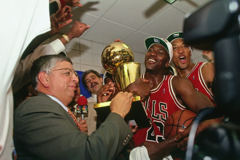 NBA Commissioner David Stern presents Michael Jordan and the Chicago Bulls the championship trophy after the Bulls defeated the Phoenix Suns in Game Six of the 1993 NBA Finals on June 20, 1993. (Photo by Andrew D. Bernstein/NBAE via Getty Images)
