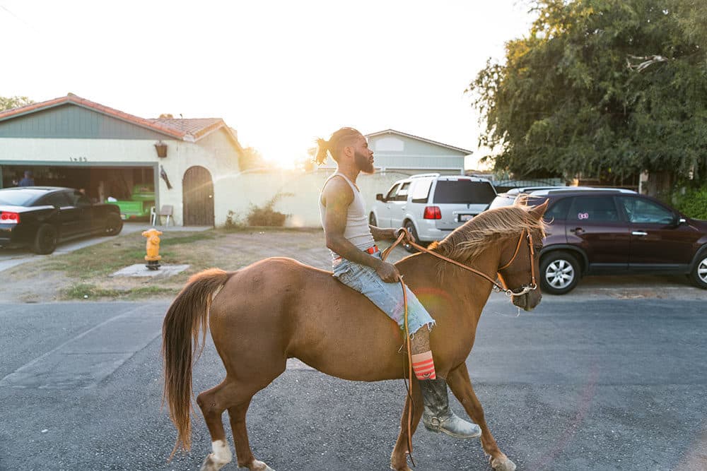 Keenan Abercrombia rides through Compton (Photo by Walter Thompson-Hernández)