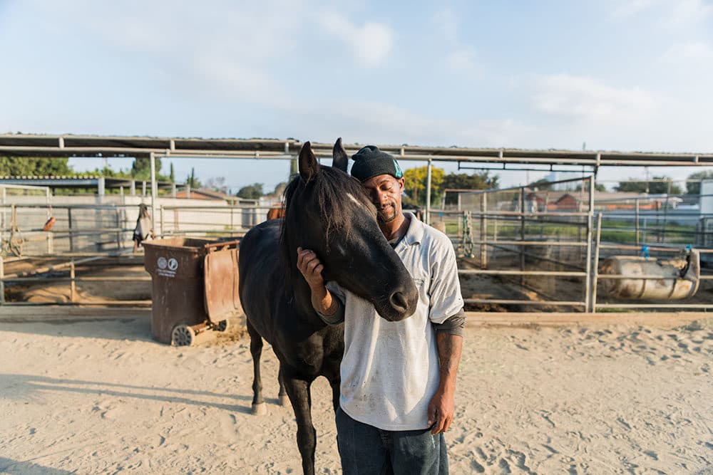 Anthony having a moment with his horse, Dakota. (Photo by Walter Thompson-Hernández)