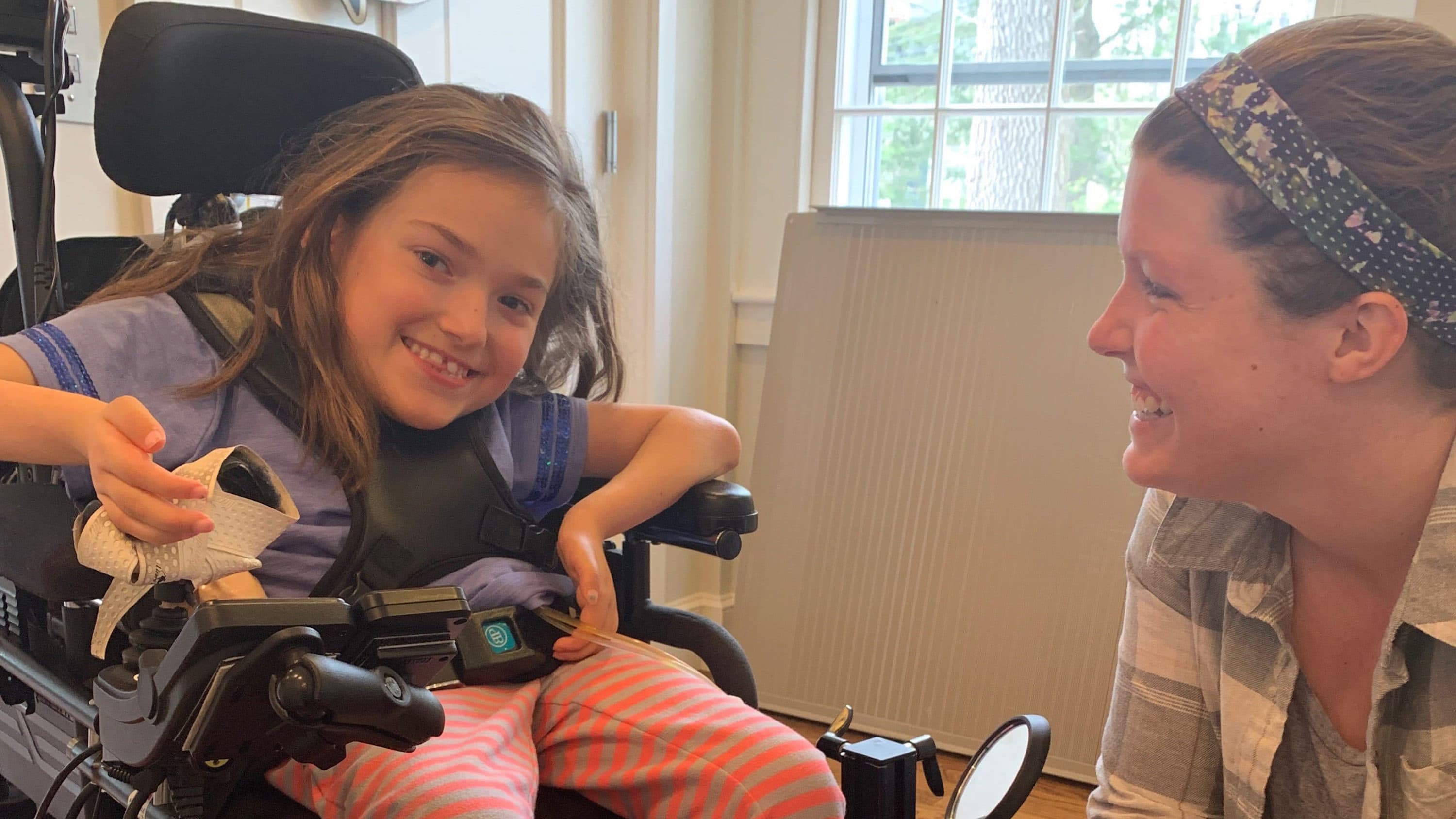 Registered Nurse Kristin Hanifin helps care for 8-year-old Harper Oates in Harper’s Brookline home. (Photo courtesy Dawn Oates)