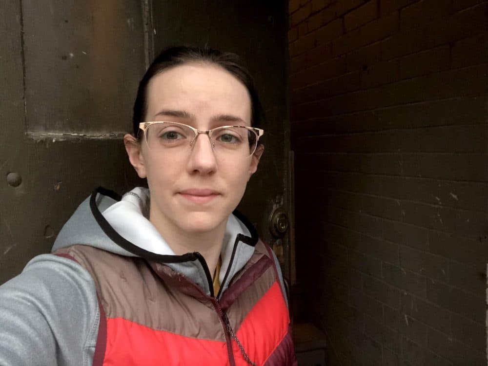 Jennifer Roach, a labor and delivery nurse, only uses the back door of her apartment to avoid encountering neighbors. She's leaves her coat and shoes in the stairwell, with signs to warn others in the building. (Courtesy Jennifer Roach)