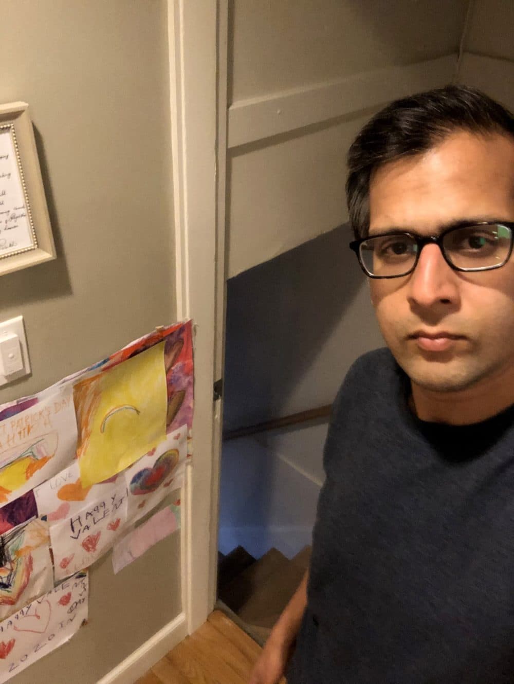 Dr. Mihir Parikh at the top of the stairs to the basement where his wife stayed in isolation with the coronavirus. From here, their young daughters would scream "hi" and "good night" and "I love you" to their mom. (Courtesy Mihir Parikh)