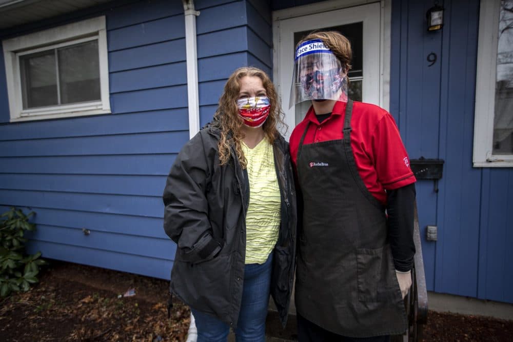 Amy Browne and her 17-year-old son Casey, who is dressed for work at Roche Brothers in West Roxbury. (Jesse Costa/WBUR)