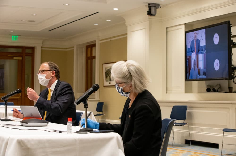 Co-Chairs Sen. Jason Lewis and Rep. Alice Peisch ran Wednesday's Education Committee hearing from a State House function room, while Education Commissioner Jeff Riley and Education Secretary James Peyser appeared virtually on screen. (Sam Doran/State House News Service)